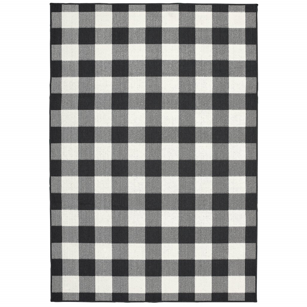 HomeRoots Polypropylene 5’x8’ Black and Ivory Gingham Indoor Outdoor Area Rug