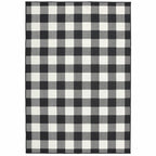 HomeRoots Polypropylene 7’x10’ Black and Ivory Gingham Indoor Outdoor Area Rug
