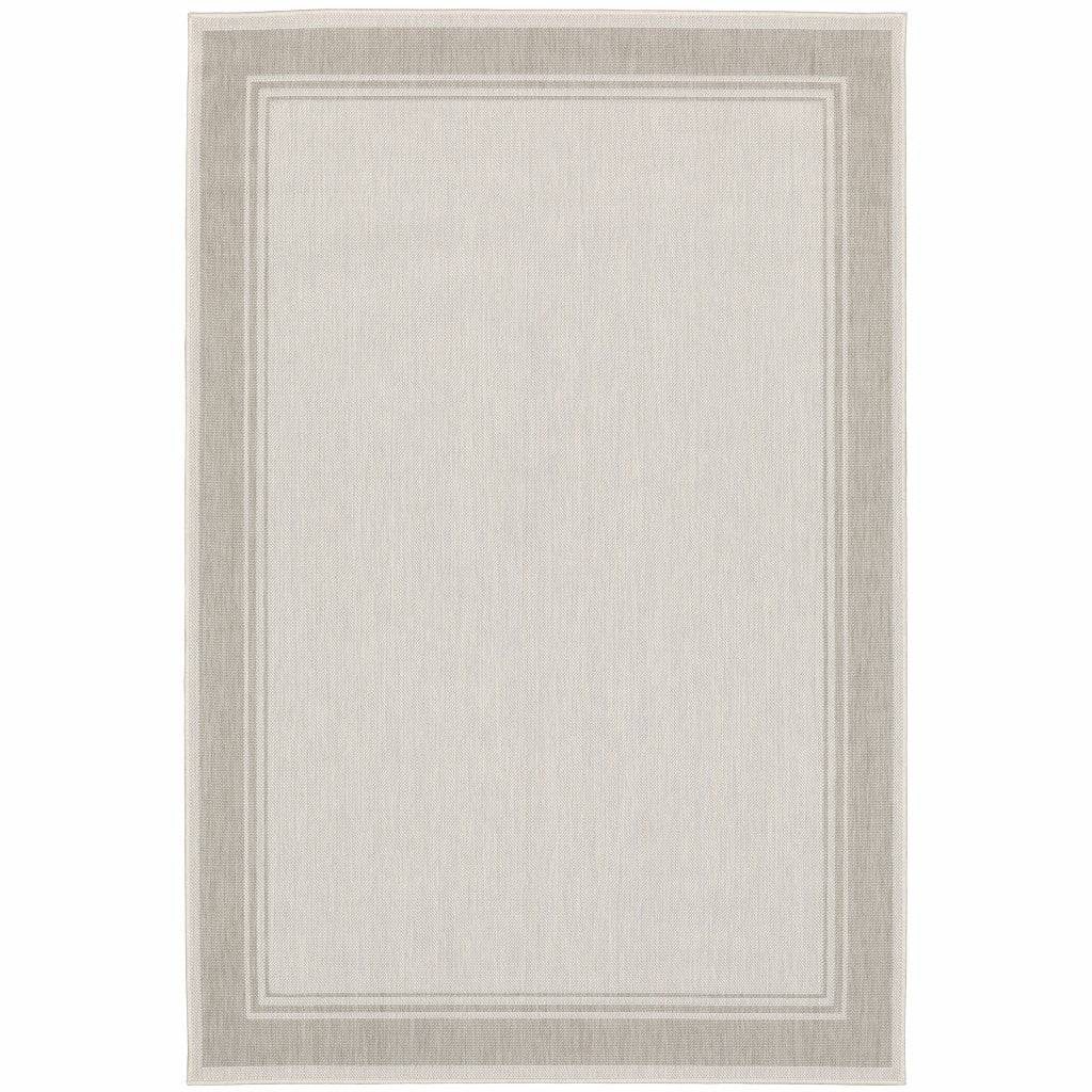 HomeRoots Polypropylene 7’x9’ Ivory and Gray Bordered Indoor Outdoor Area Rug