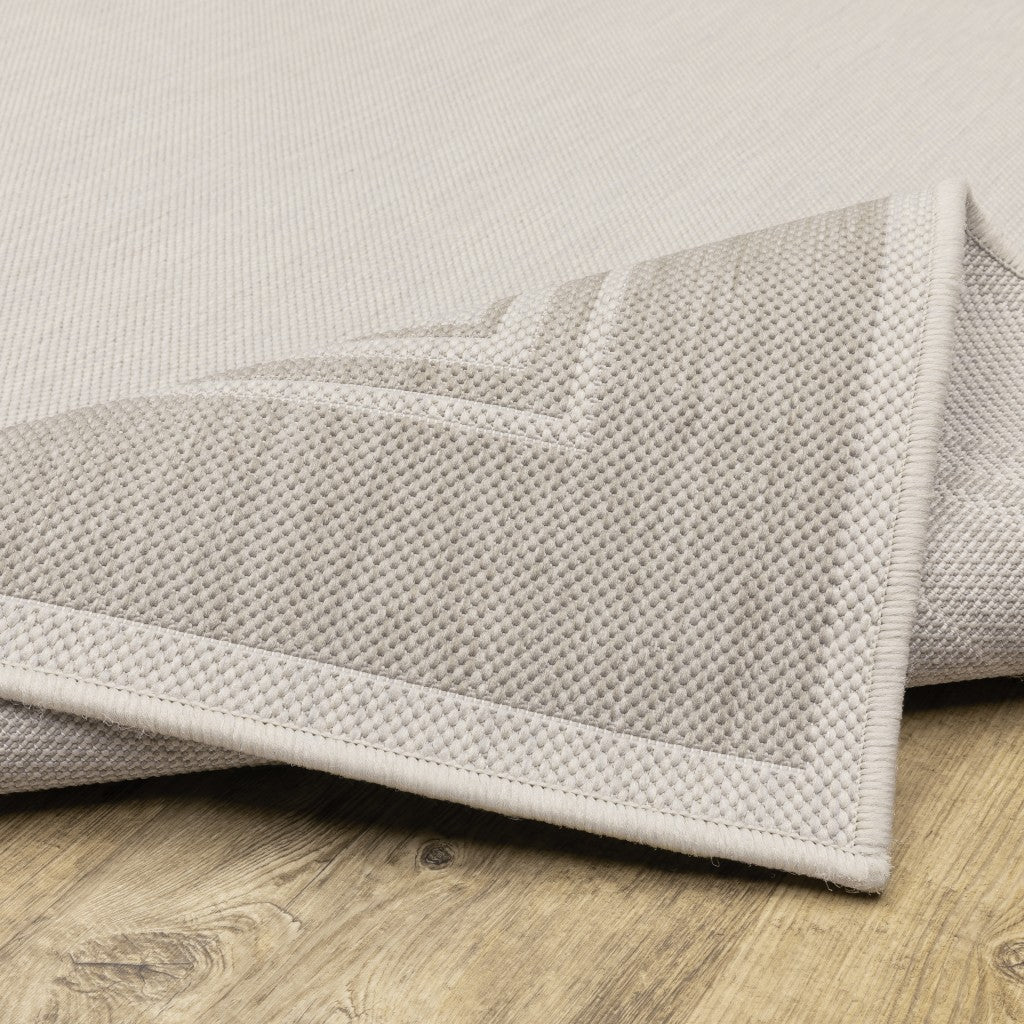 HomeRoots Polypropylene 7’x9’ Ivory and Gray Bordered Indoor Outdoor Area Rug