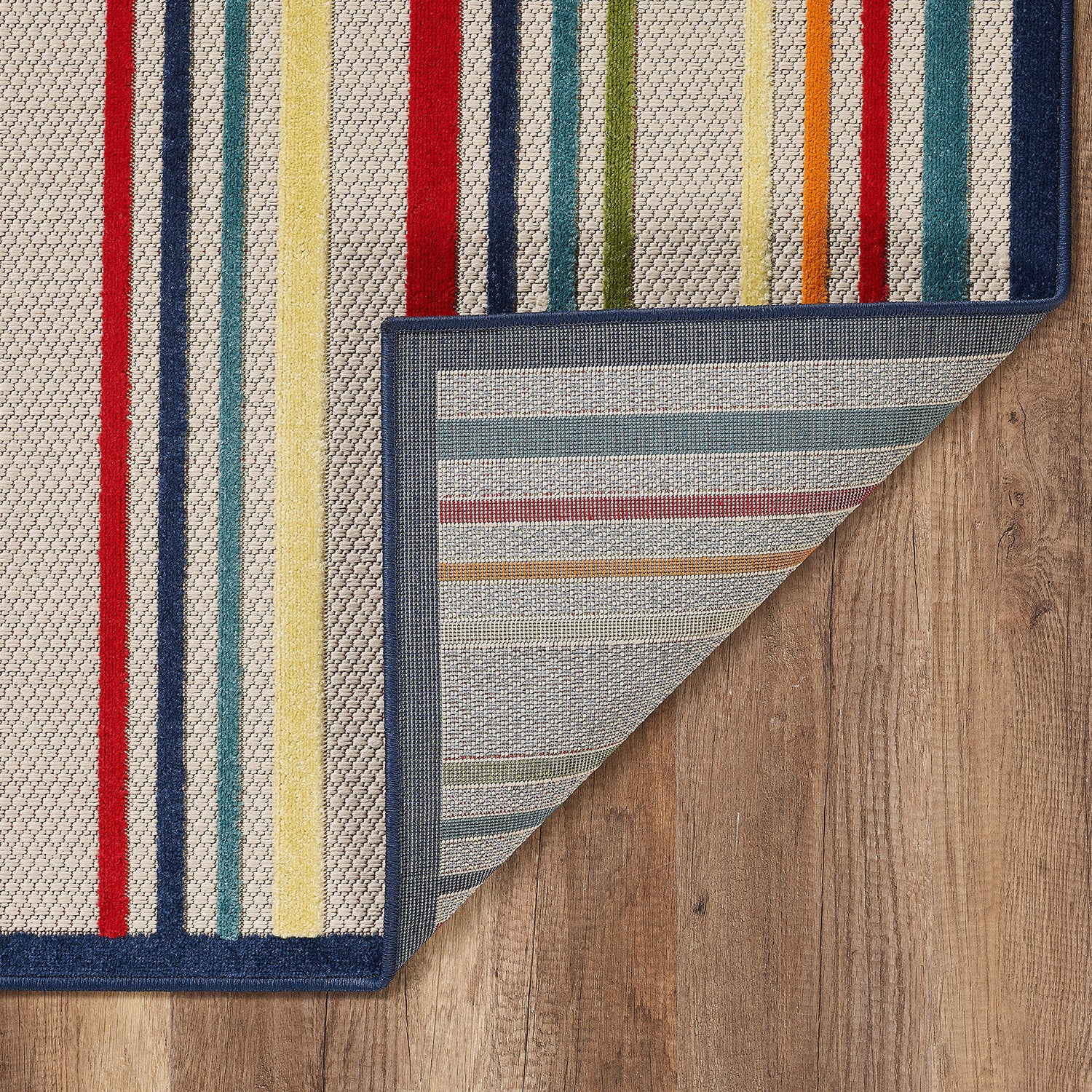 HomeRoots Ivory UV-Treated Polypropylene 5’ x 7’ Navy Colorful Striped Indoor Outdoor Area Rug