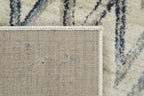 HomeRoots Ivory Heat-Set Polypropelene 5’ x 8’ Beige Blue Distressed Chevron Area Rug
