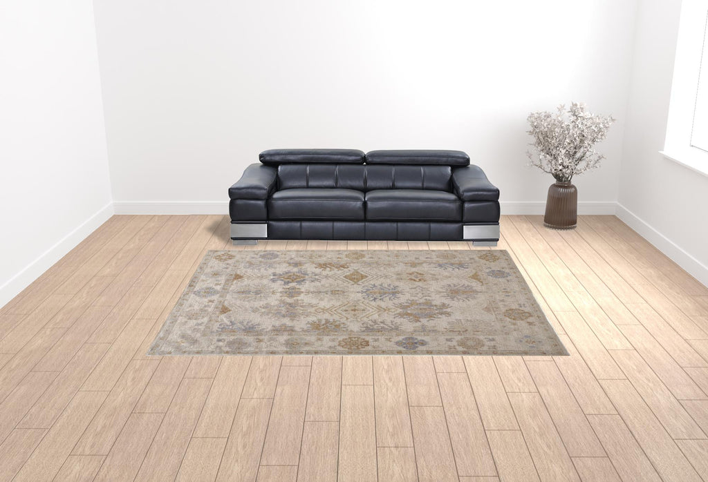 HomeRoots 514966 9 x 12 ft. Ivory Tan & Blue Floral Hand Knotted Stain Resistant Rectangle Area Rug