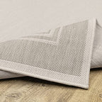 HomeRoots Polypropylene 7’x9’ Ivory and Gray Bordered Indoor Outdoor Area Rug