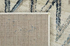 HomeRoots Ivory Heat-Set Polypropelene 5’ x 8’ Beige Blue Distressed Chevron Area Rug