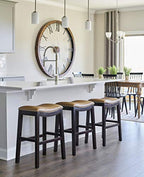 HomeRoots Vinyl, Wood, Steel 25' Espresso and Carmel Saddle Style Counter Height Bar Stool
