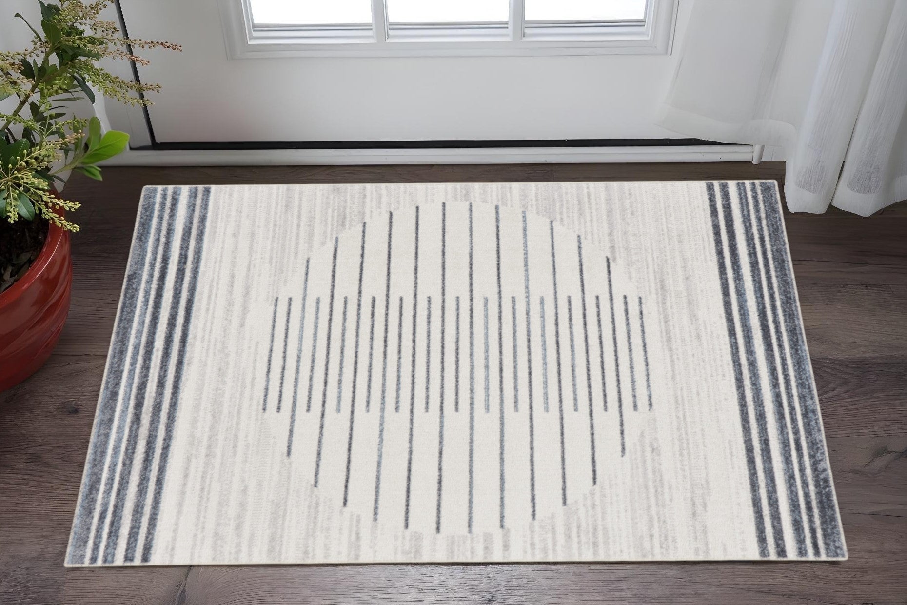 3 X 5 Ivory And Blue Geometric Washable Area Rug