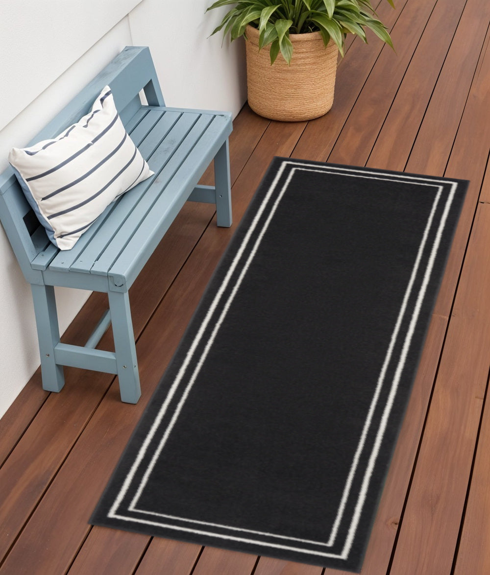 6 Black And Ivory Indoor Outdoor Runner Rug