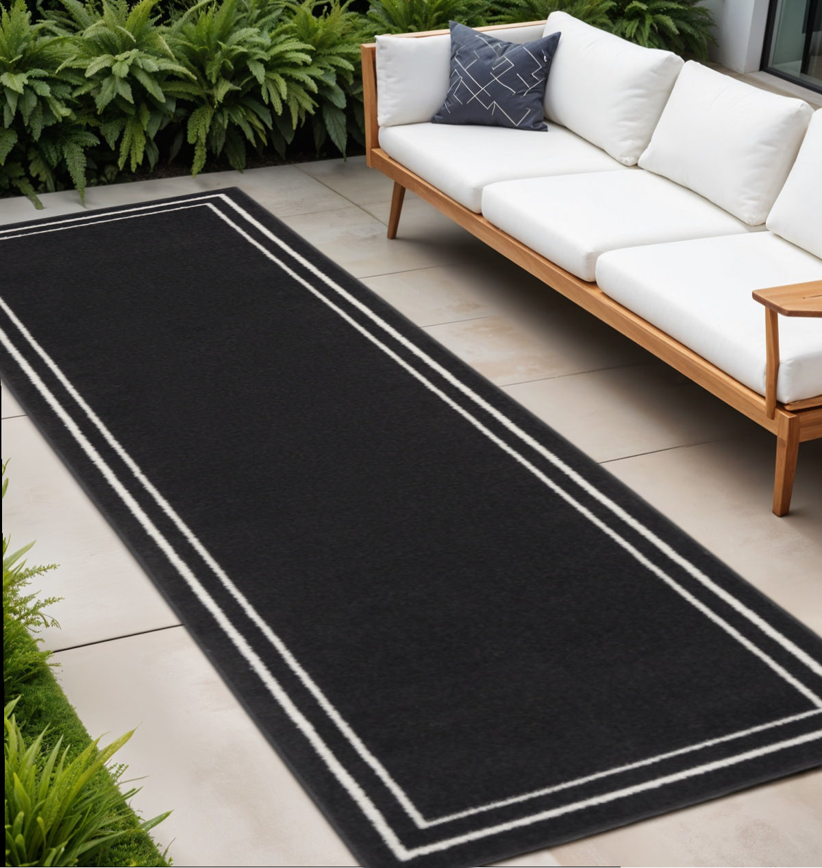 8 Black And Ivory Indoor Outdoor Runner Rug
