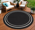 8 Black And Ivory Round Indoor Outdoor Area Rug