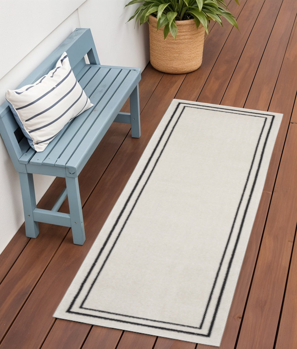 6 Ivory And Black Indoor Outdoor Runner Rug