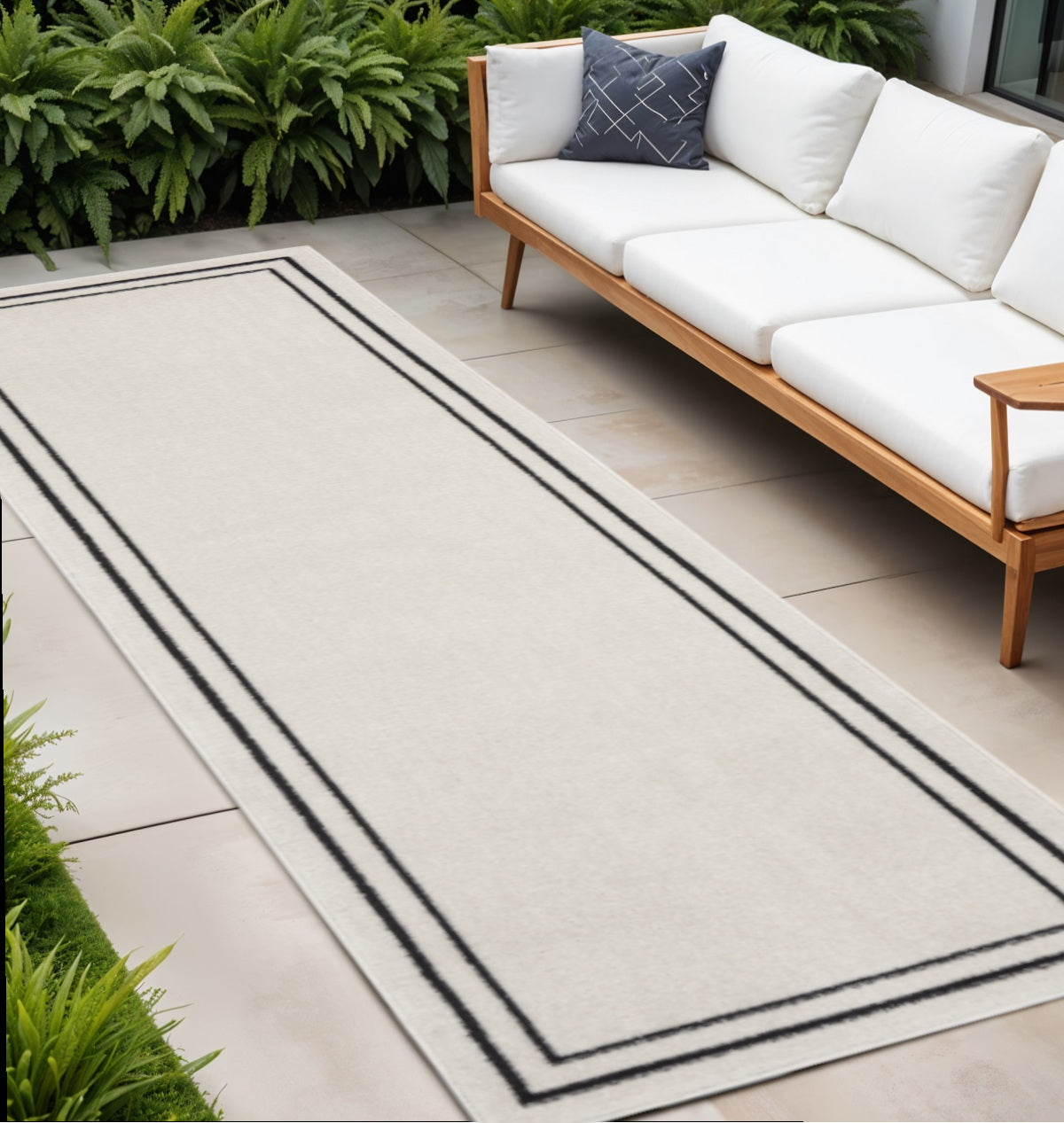 8 Ivory And Black Indoor Outdoor Runner Rug