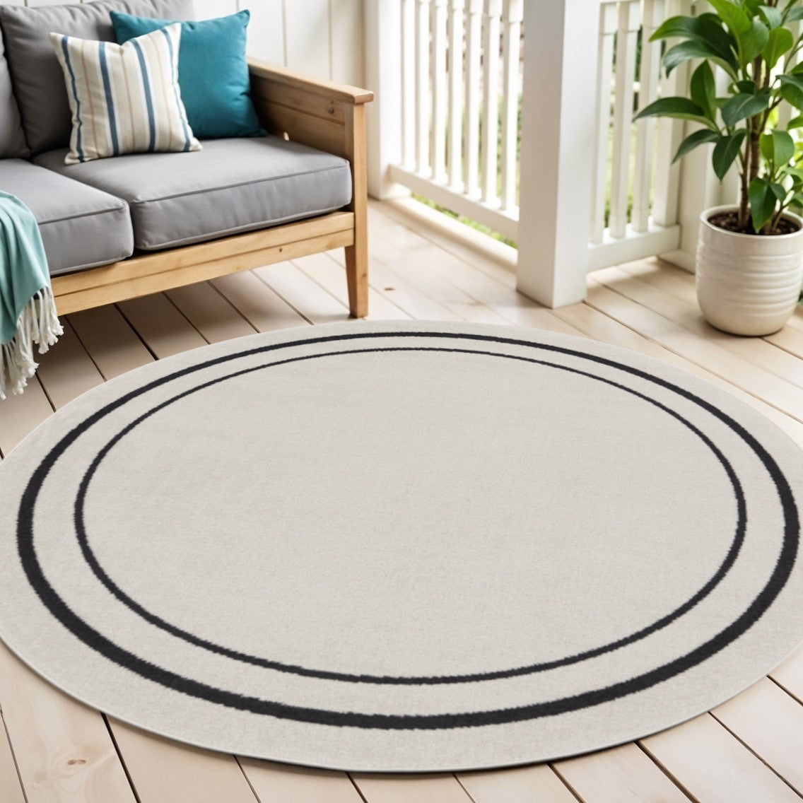 6 Ivory And Black Round Indoor Outdoor Area Rug