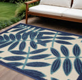 8 X 11 Navy Blue And Ivory Palm Leaf Indoor Outdoor Area Rug