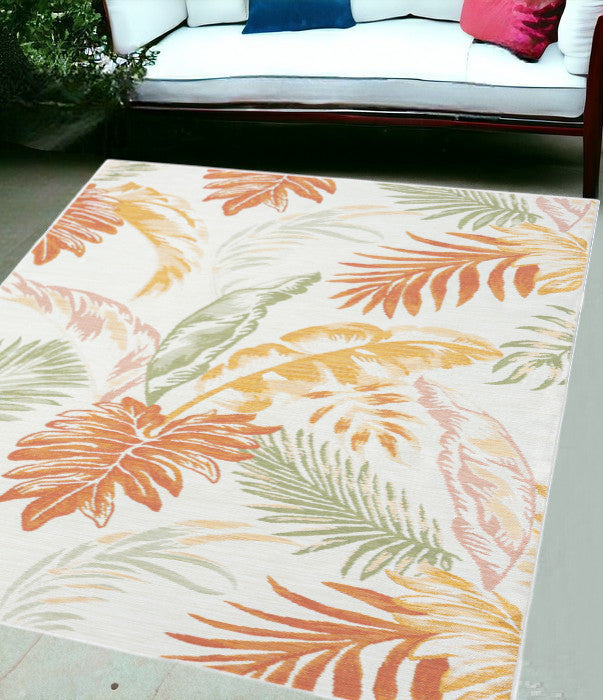 5' X 7' Ivory Green And Orange Palm Leaf Stain Resistant Indoor Outdoor Area Rug