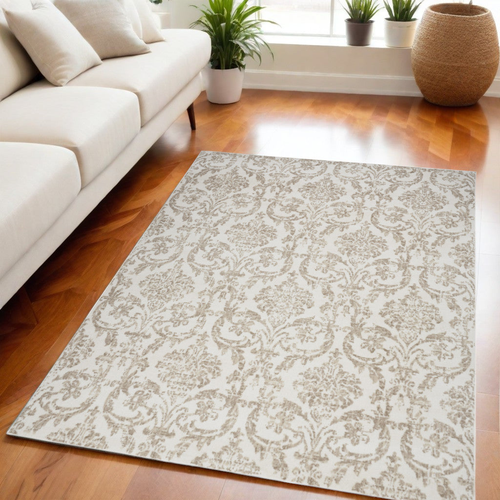 5' X 7' Beige and Ivory Damask Distressed Non Skid Area Rug