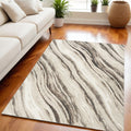 5' X 7' Beige Black and Gray Abstract Non Skid Area Rug