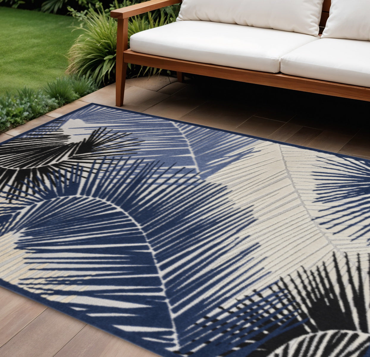 8 X 10 Navy Blue Ivory And Black Palm Leaf Indoor Outdoor Area Rug
