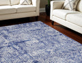7' X 10' Ivory and Navy Blue Abstract Distressed Non Skid Area Rug