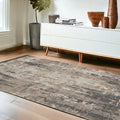 4' X 6' Cream Black and Gray Abstract Area Rug
