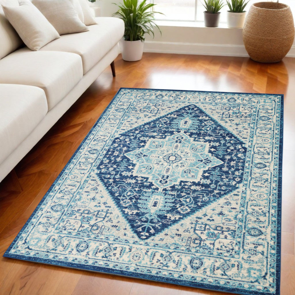 5' X 7' Ivory And Navy Blue Floral Medallion Distressed Area Rug
