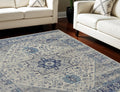 7' X 10' Ivory And Light Blue Floral Medallion Distressed Area Rug