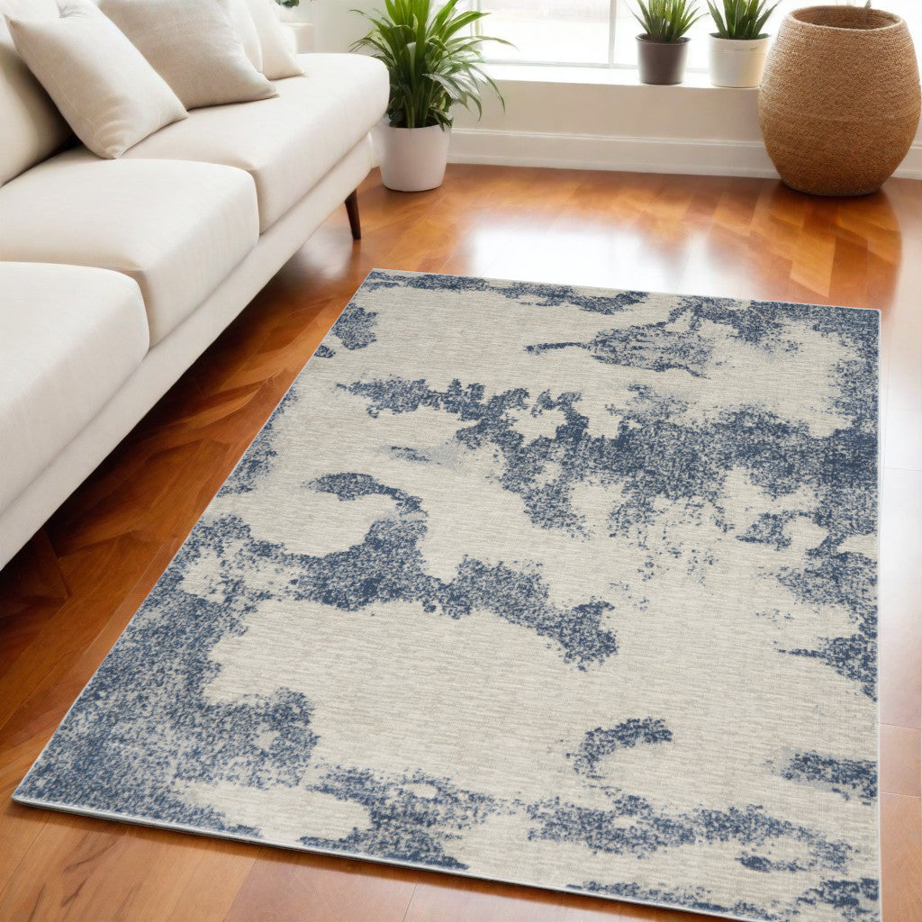 5' X 7' Light Blue and Ivory Abstract Non Skid Area Rug