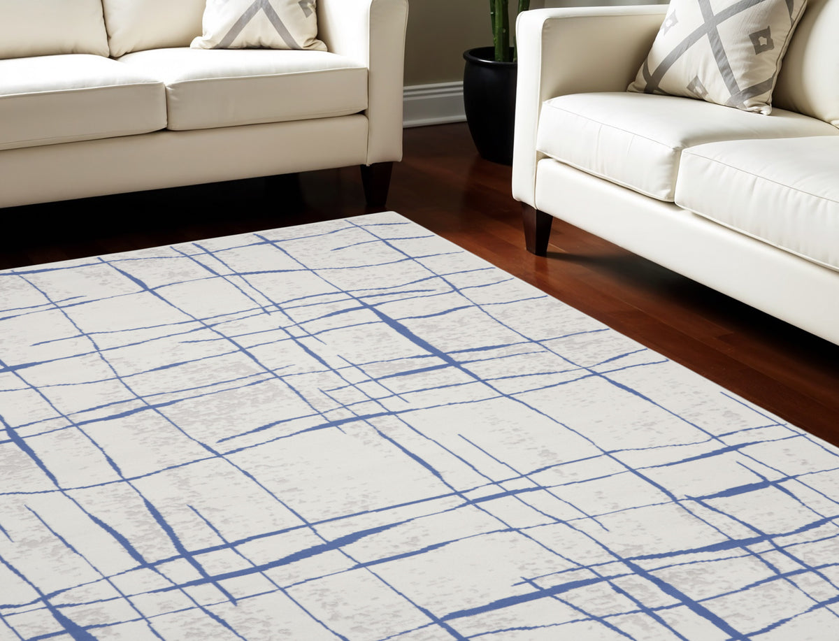8' X 12' Ivory and Blue Abstract Geometric Distressed Non Skid Area Rug