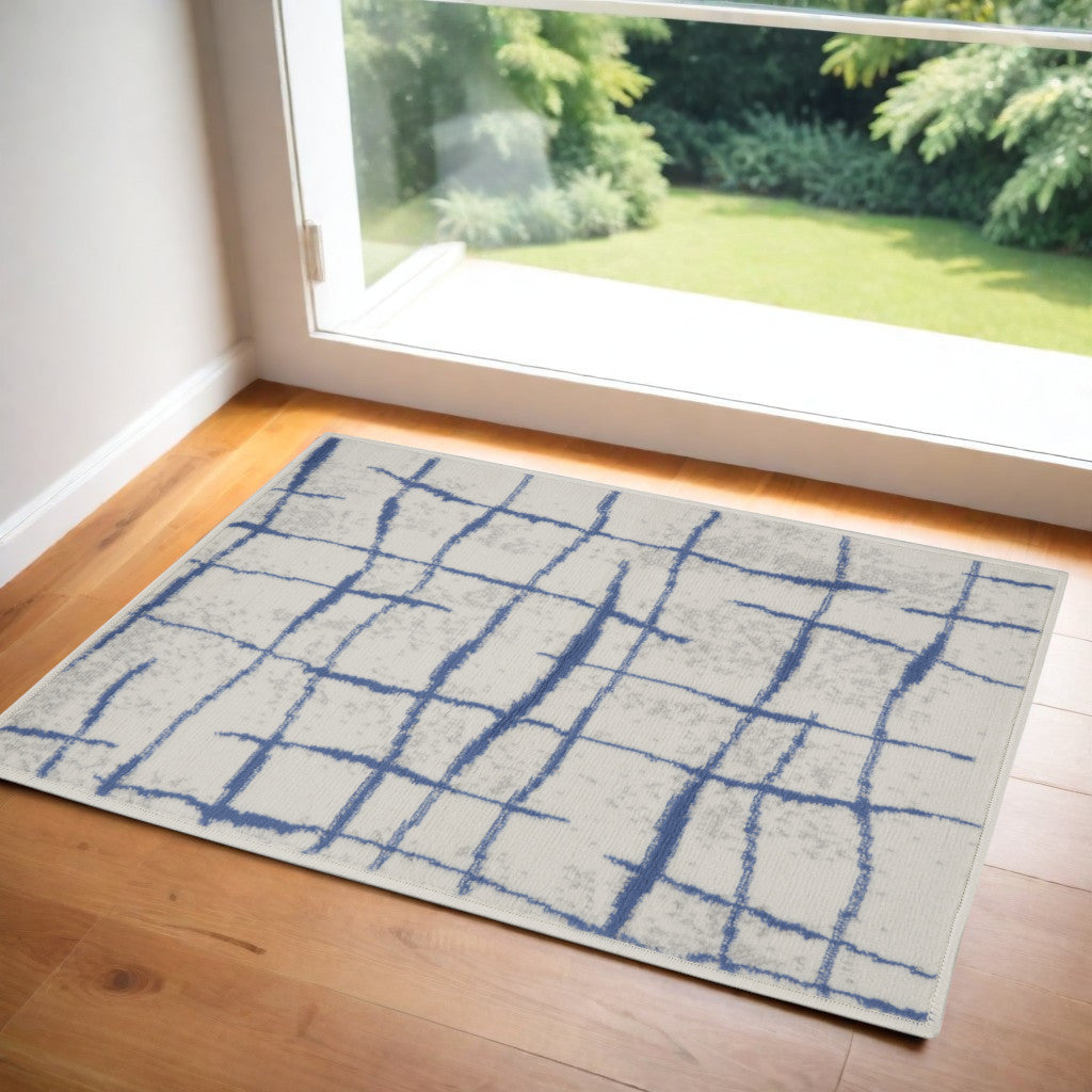 3' X 5' Ivory and Blue Abstract Geometric Distressed Area Rug