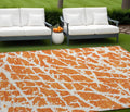 10' X 14' Orange And White Abstract Washable Non Skid Indoor Outdoor Area Rug
