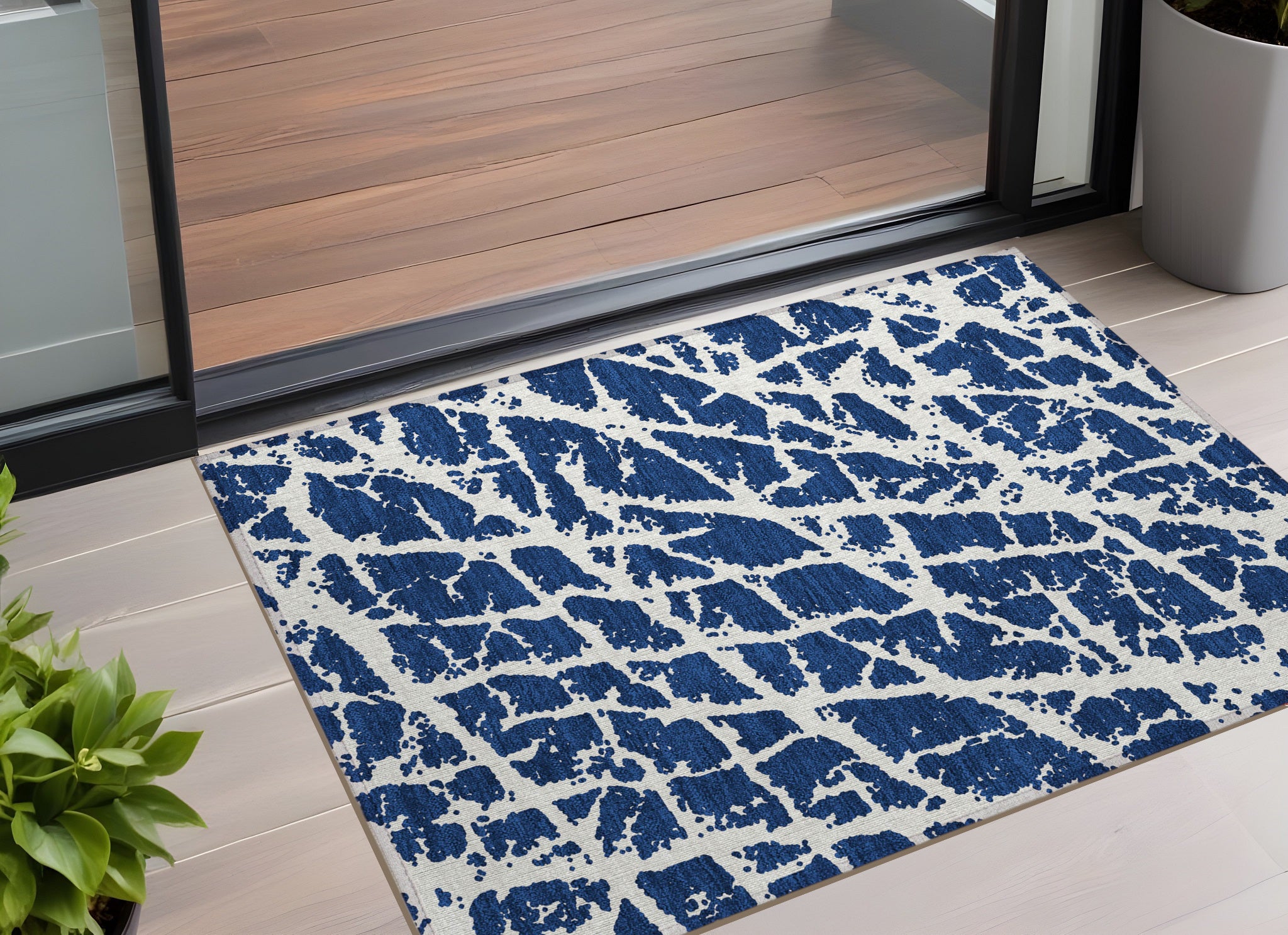 2' X 3' Navy And Ivory Abstract Washable Non Skid Indoor Outdoor Area Rug