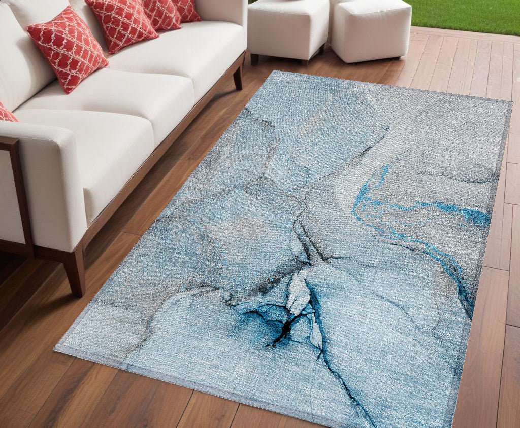 5' X 8' Blue And Ivory Abstract Washable Non Skid Indoor Outdoor Area Rug
