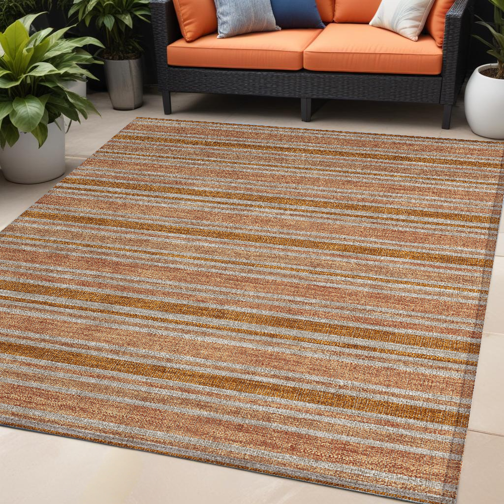 5' X 8' Beige And Orange Striped Washable Non Skid Indoor Outdoor Area Rug