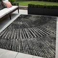 5' X 8' Black And Ivory Abstract Washable Non Skid Indoor Outdoor Area Rug