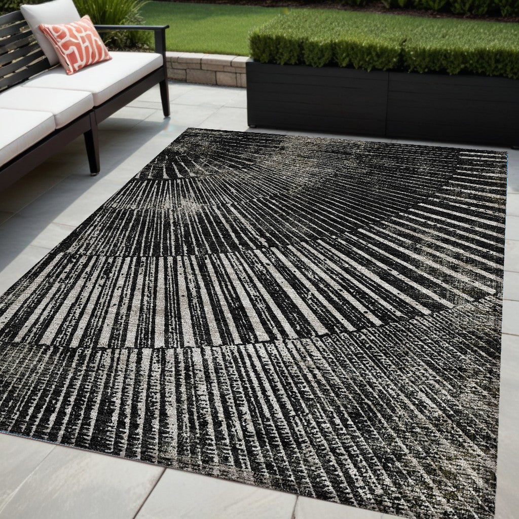 5' X 8' Black And Ivory Abstract Washable Non Skid Indoor Outdoor Area Rug
