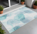 2' X 3' Teal And Ivory Abstract Washable Non Skid Indoor Outdoor Area Rug