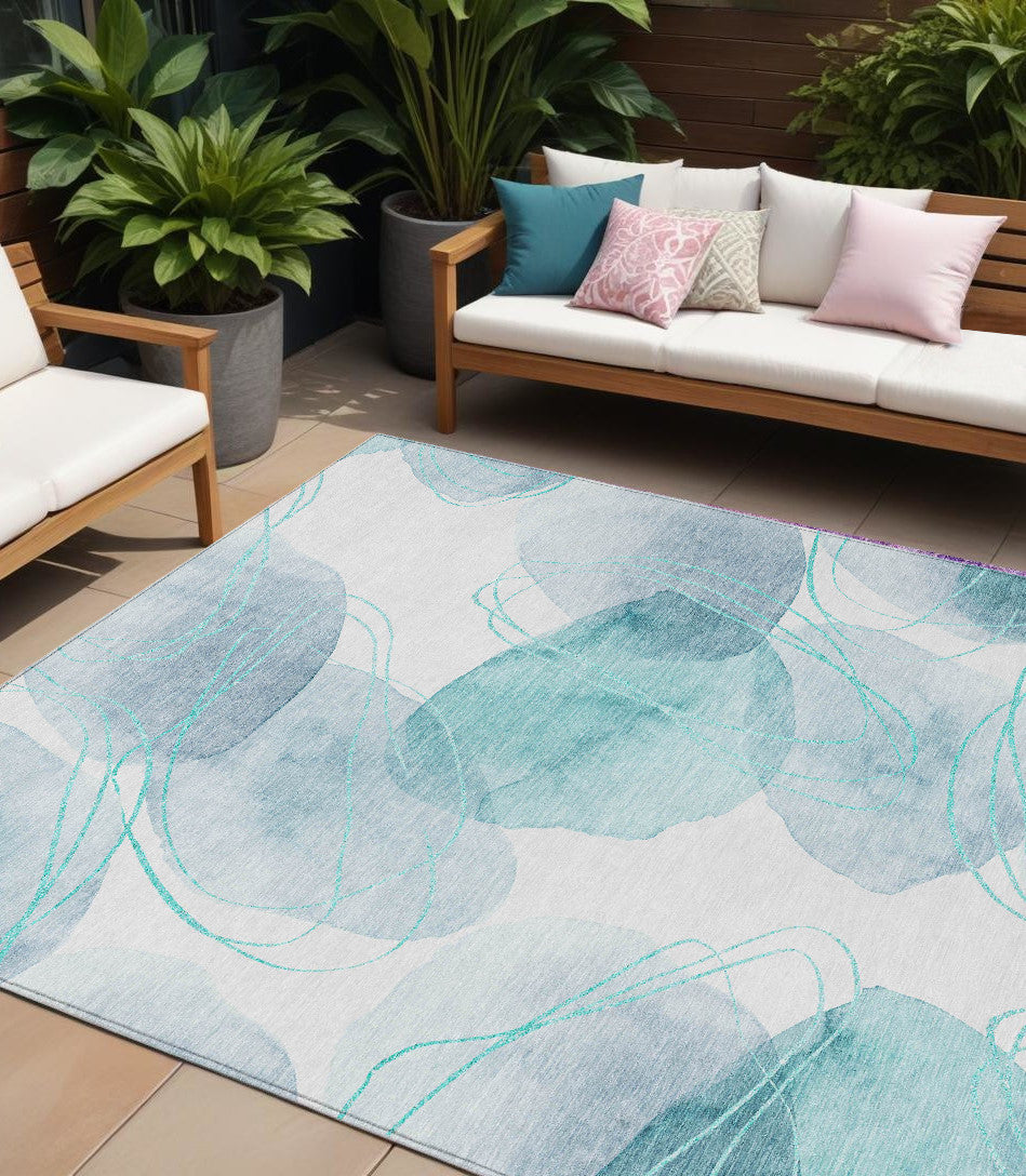 9' X 12' Teal And Ivory Abstract Washable Non Skid Indoor Outdoor Area Rug