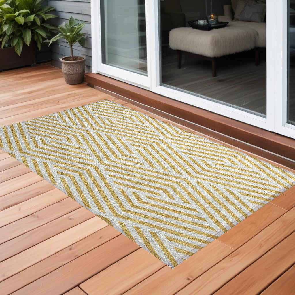3' X 5' Gold And White Geometric Washable Non Skid Indoor Outdoor Area Rug