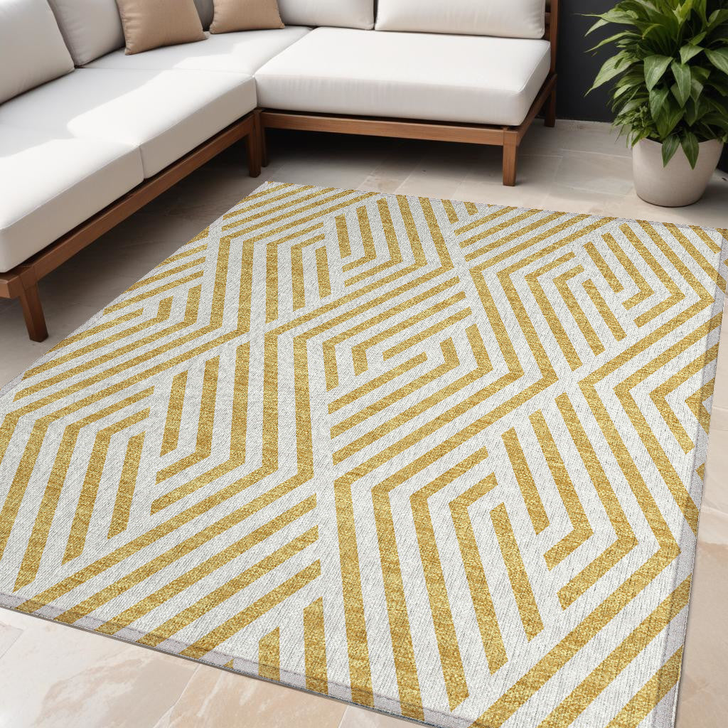 5' X 8' Gold And White Geometric Washable Non Skid Indoor Outdoor Area Rug