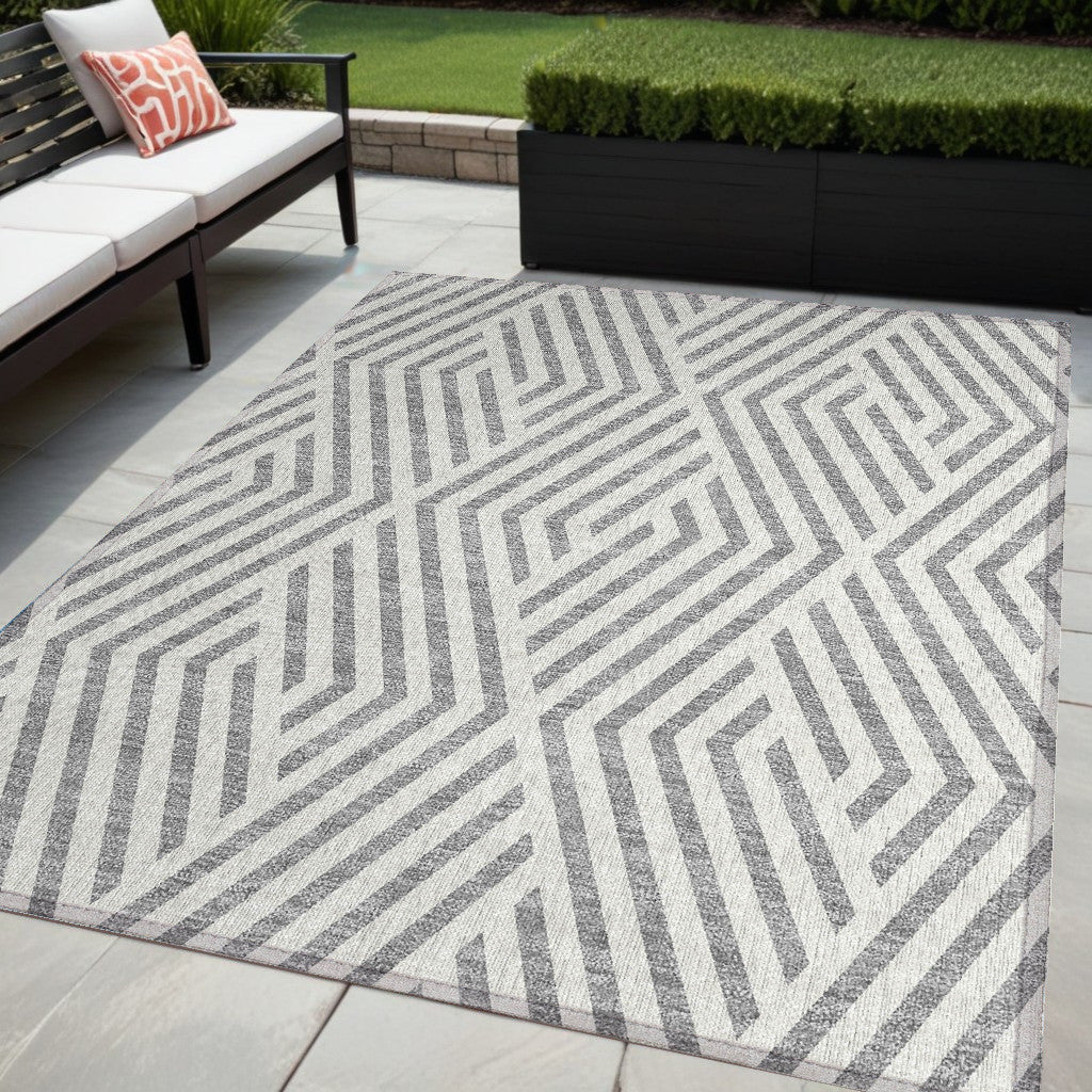 5' X 8' Gray And Ivory Geometric Washable Non Skid Indoor Outdoor Area Rug