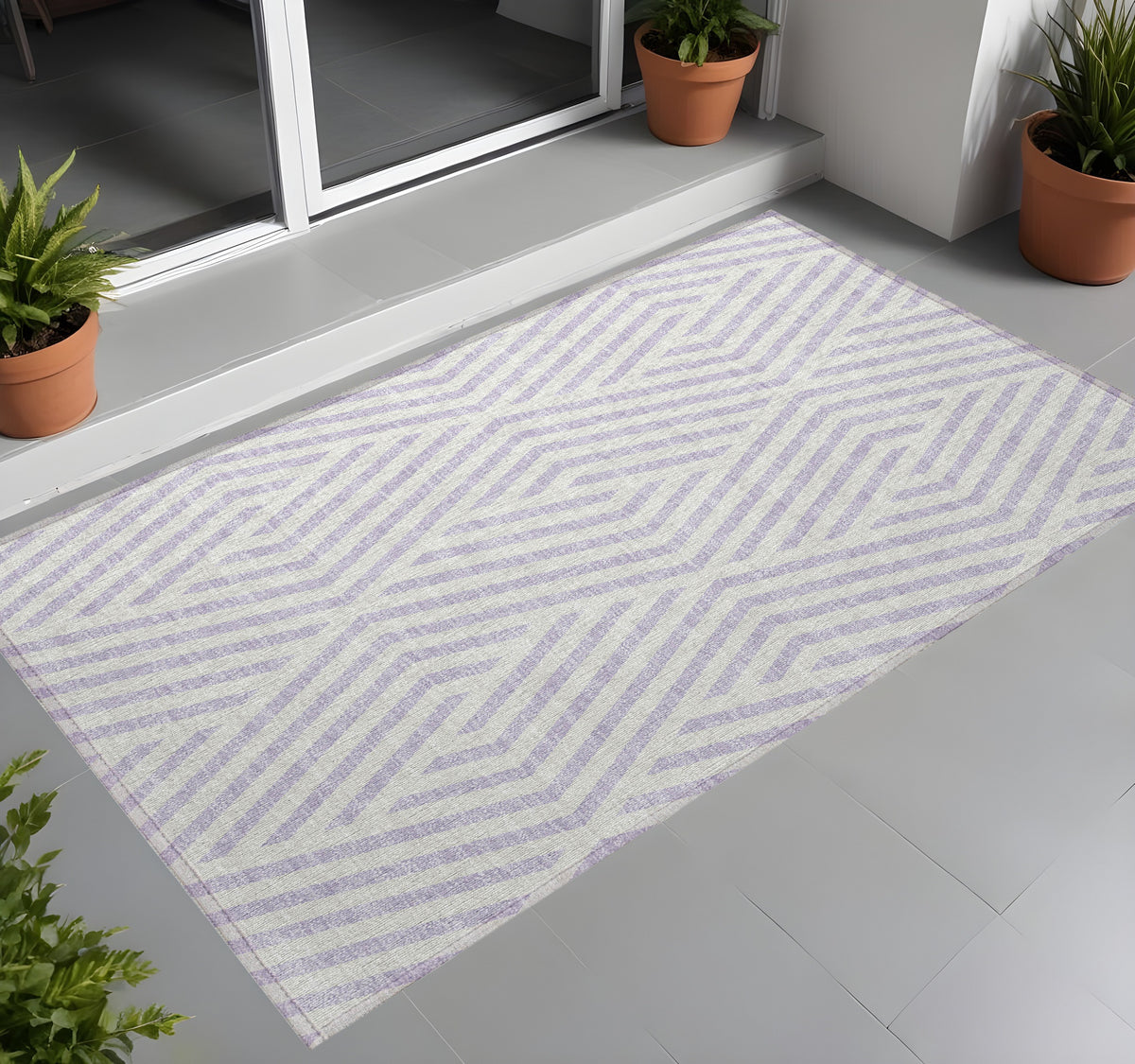 3' X 5' Lavender And Ivory Geometric Washable Non Skid Indoor Outdoor Area Rug
