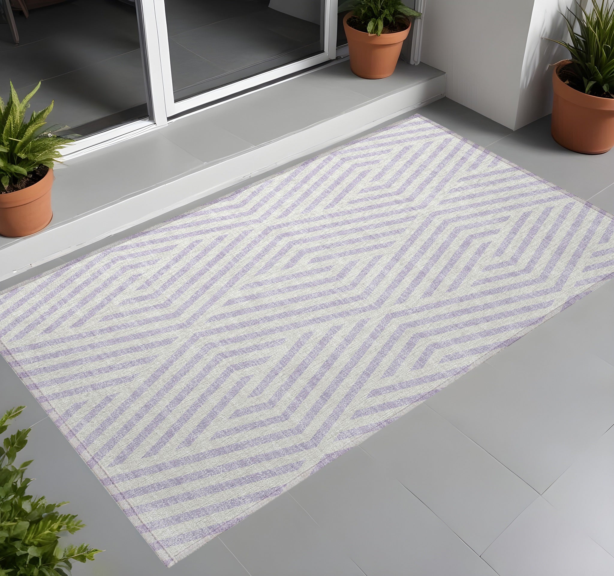 3' X 5' Lavender And Ivory Geometric Washable Non Skid Indoor Outdoor Area Rug