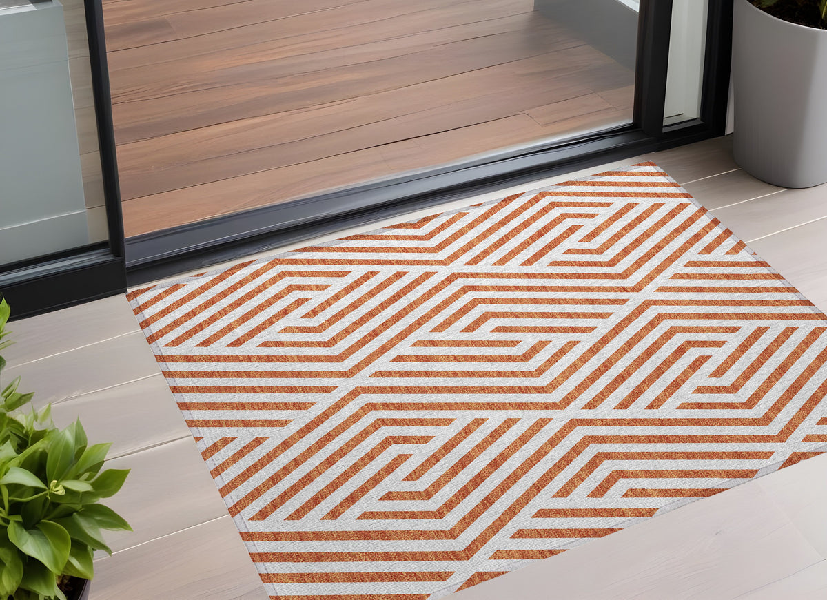 3' X 5' Orange And White Geometric Washable Non Skid Indoor Outdoor Area Rug