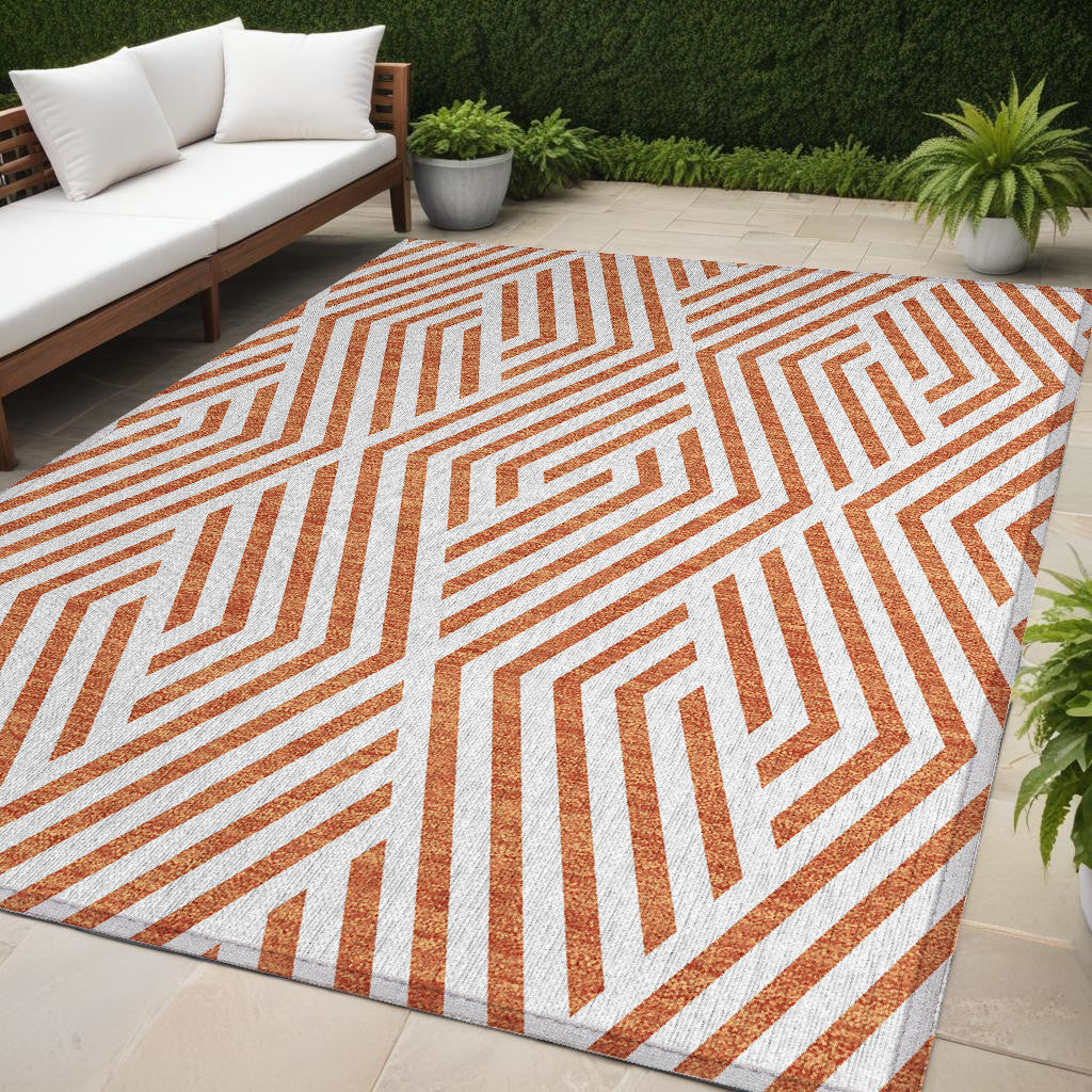 5' X 8' Orange And White Geometric Washable Non Skid Indoor Outdoor Area Rug