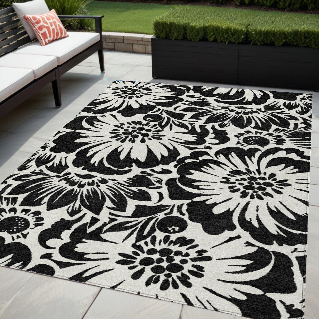 5' X 8' Black And Ivory Floral Washable Non Skid Indoor Outdoor Area Rug
