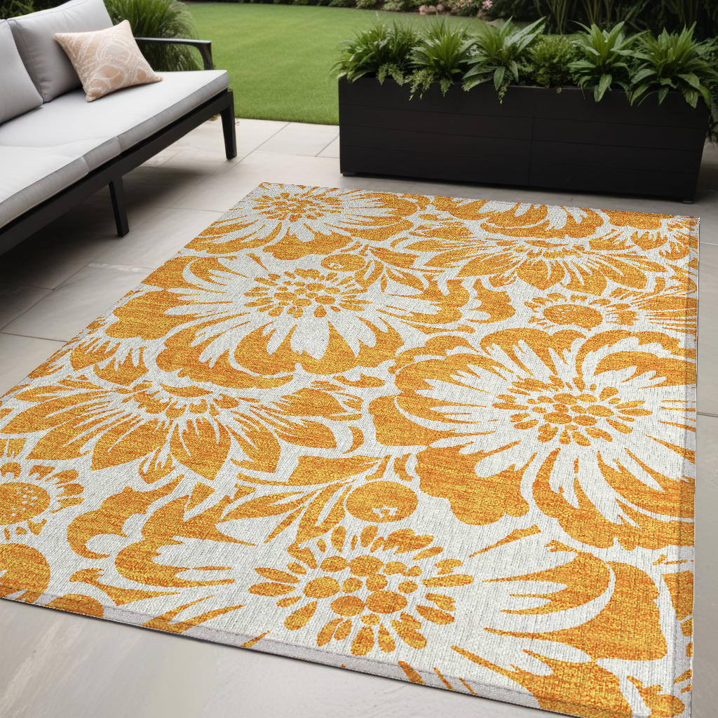 5' X 8' Orange And White Floral Washable Non Skid Indoor Outdoor Area Rug