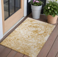 2' X 3' Cream And Gold Abstract Washable Non Skid Indoor Outdoor Area Rug
