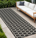 8 Black And Ivory Geometric Indoor Outdoor Runner Rug