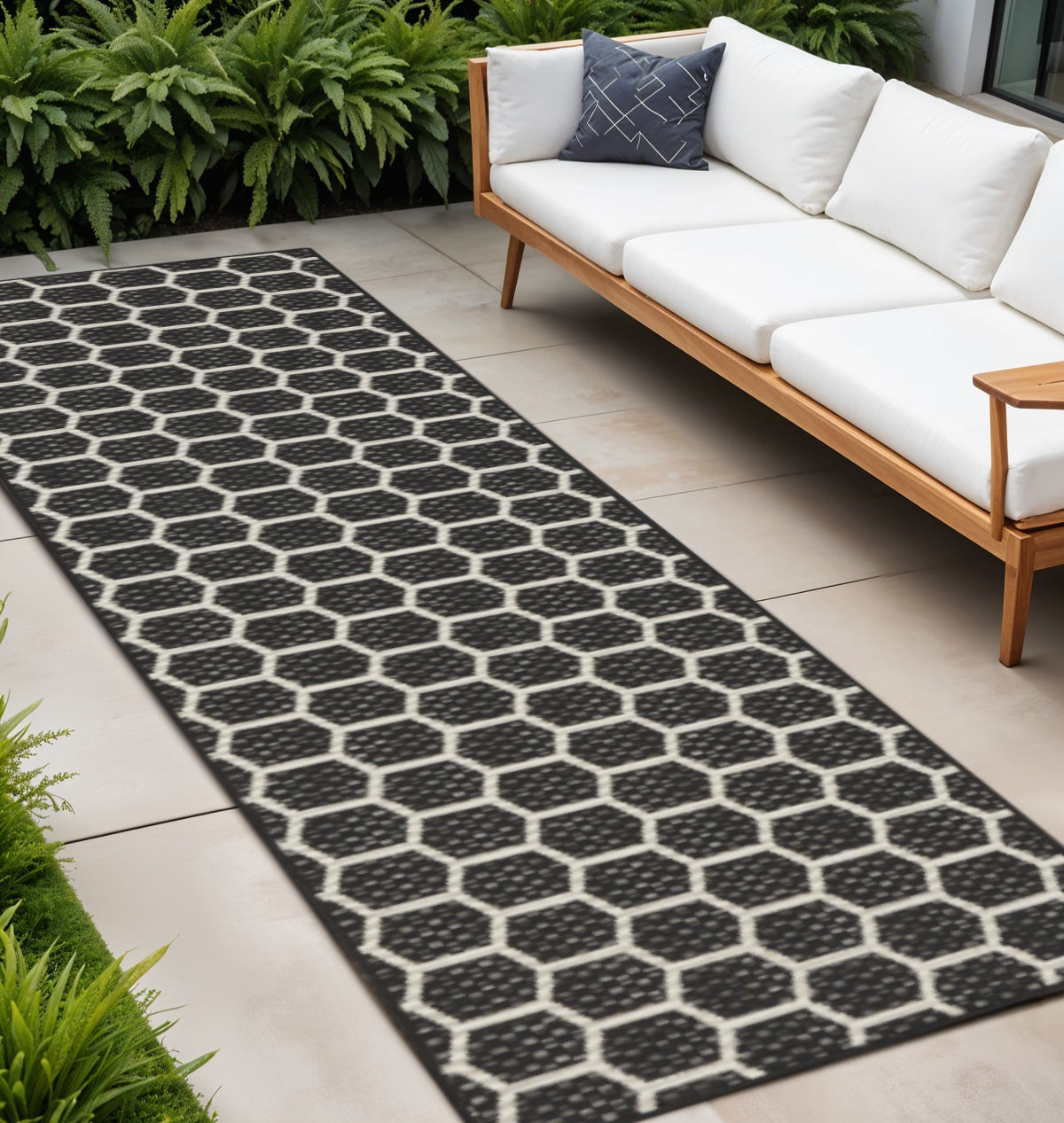 10 Black And Ivory Geometric Indoor Outdoor Runner Rug