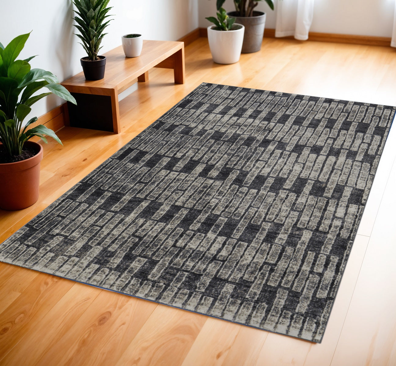 4' X 6' Gray and Black Geometric Power Loom Worn Faded Area Rug